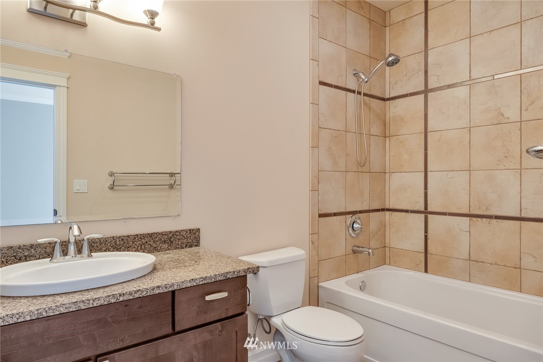 17725 Southeast 123rd Place Renton, WA 98059 - Photo 24 of 37 a bathroom with a sink a toilet and shower