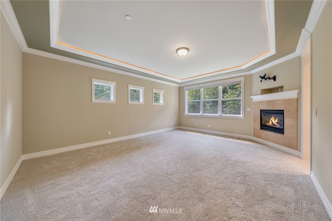 17725 Southeast 123rd Place Renton, WA 98059 - Photo 25 of 37 a view of empty room with a fireplace
