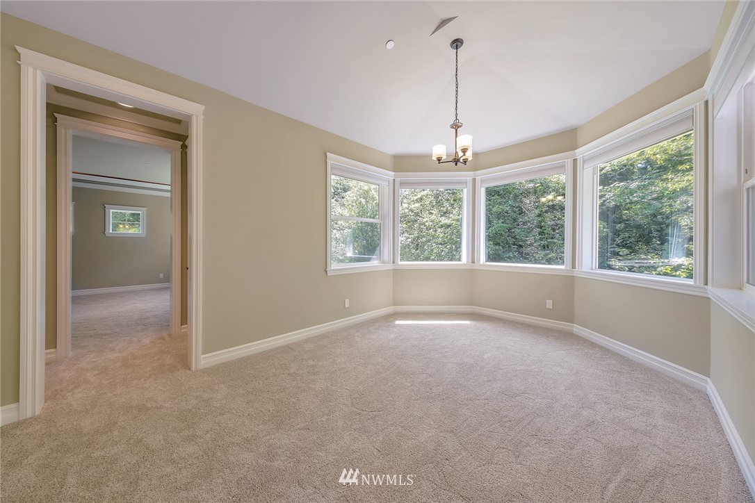 17725 Southeast 123rd Place Renton, WA 98059 - Photo 27 of 37 an empty room with windows and outdoor view
