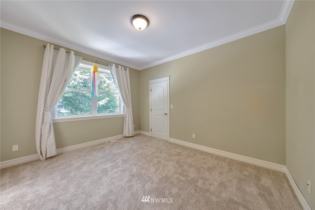 17725 Southeast 123rd Place Renton, WA 98059 - Photo 32 of 37 an empty room with large windows