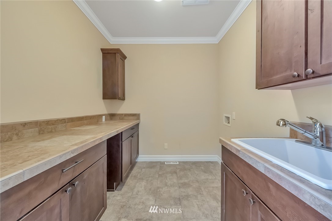 17725 Southeast 123rd Place Renton, WA 98059 - Photo 35 of 37 a bathroom with a sink and a mirror