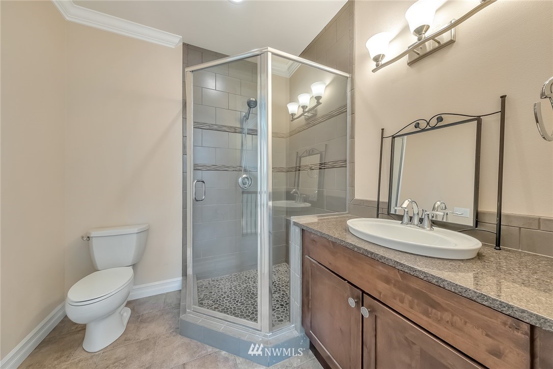 17725 Southeast 123rd Place Renton, WA 98059 - Photo 36 of 37 a bathroom with a granite countertop sink toilet and shower