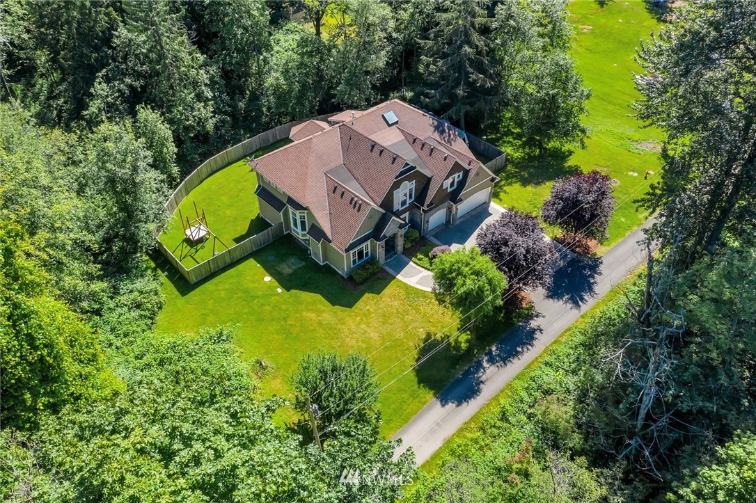 17725 Southeast 123rd Place Renton, WA 98059 - Photo 5 of 37 an aerial view of a house with a garden and swimming pool