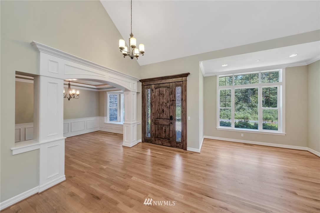 17725 Southeast 123rd Place Renton, WA 98059 - Photo 10 of 37 a view of an empty room with wooden floor and a window