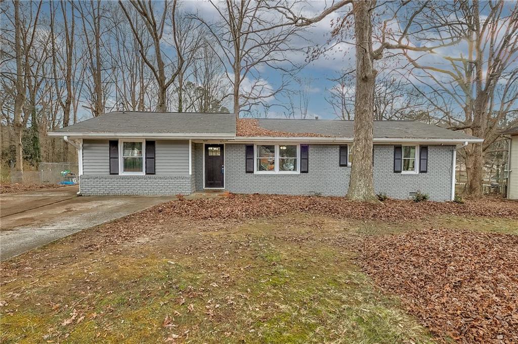 703 Boggs Road Mableton, GA 30126 - Photo 1 of 1 front view of house with a yard