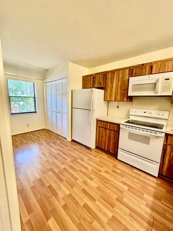 a view of kitchen and wooden floor