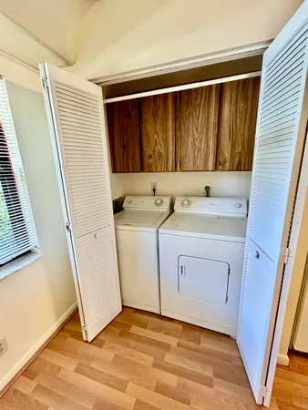 a bathroom with a sink a toilet a mirror and shower