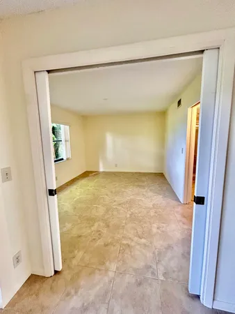 an empty room with a mirror