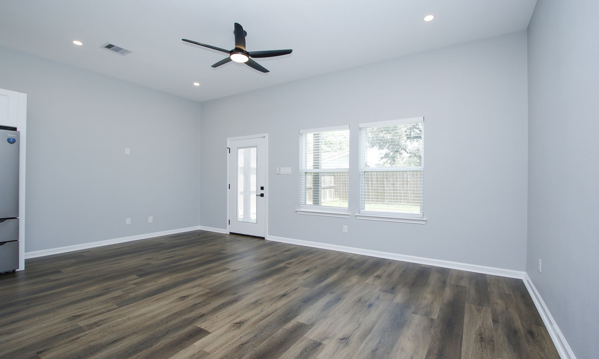 4337 Faulkner Street Houston, TX 77021 - Photo 10 of 39 wooden floor in an empty room with a window