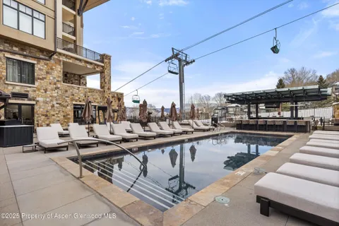 a view of a balcony and chairs