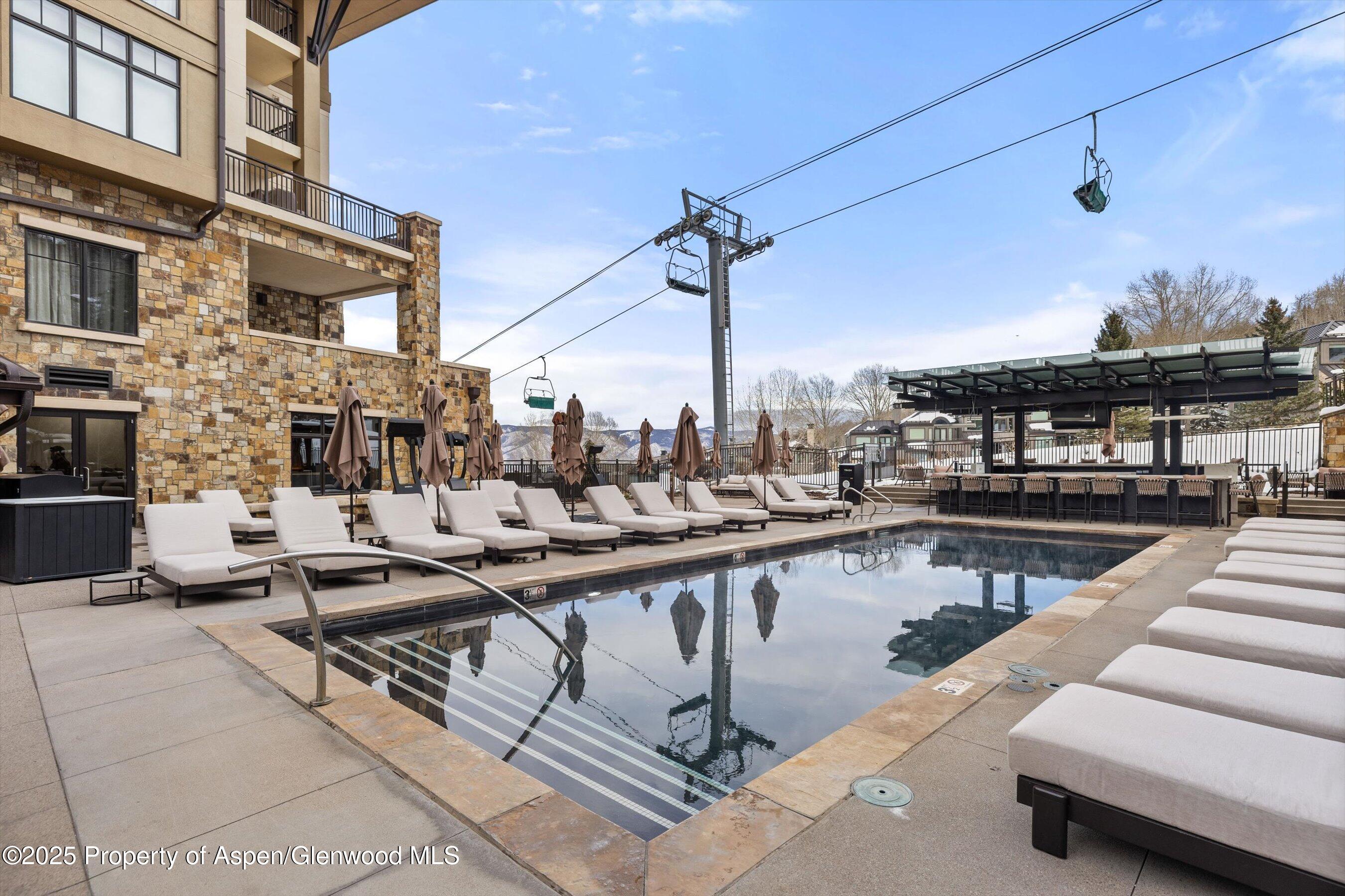 130 Wood Road, Unit 560562 Snowmass Village, CO 81615 - Photo 29 of 37 a view of a balcony and chairs