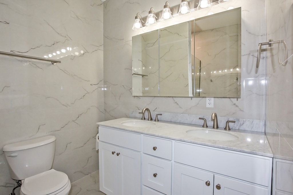 165 Sandisfield Road Sandisfield, MA 01255 - Photo 18 of 37 a bathroom with a toilet sink and mirror