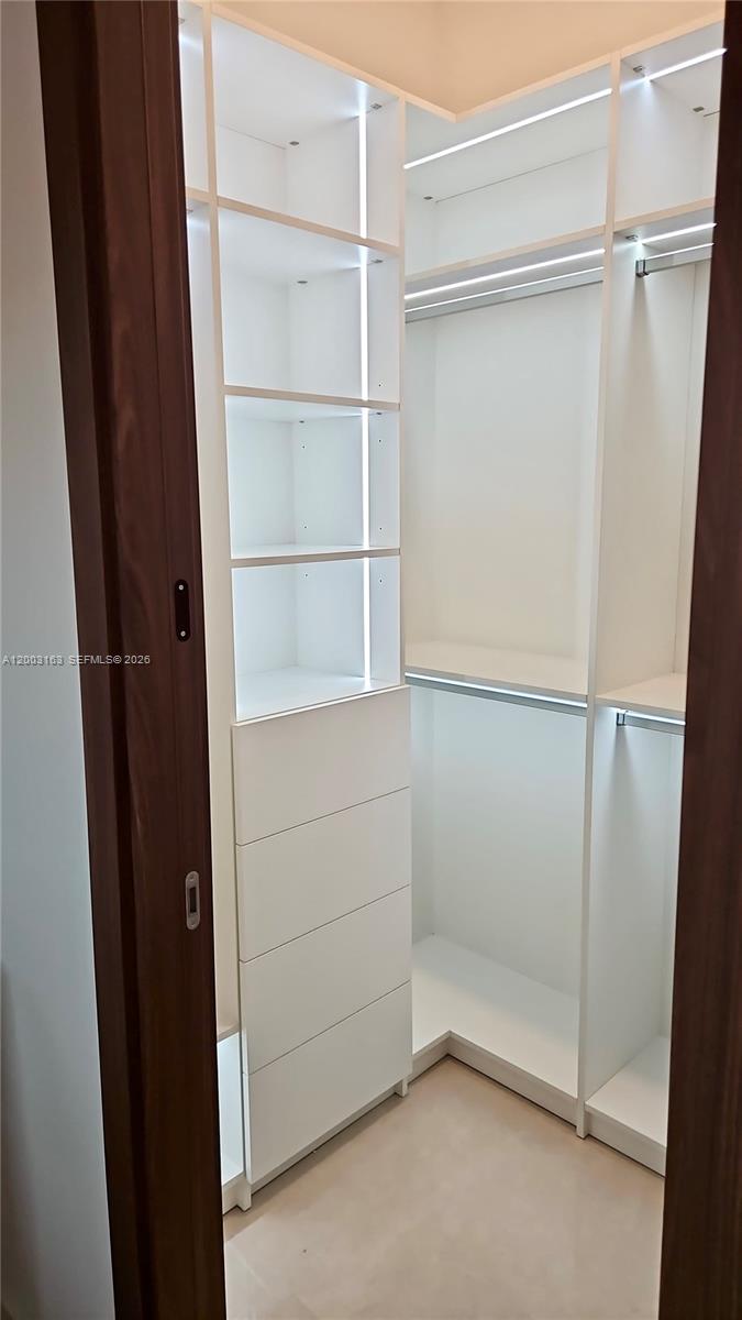 760 Woodcrest Road Key Biscayne, FL 33149 - Photo 17 of 43 a view of an empty walk in closet