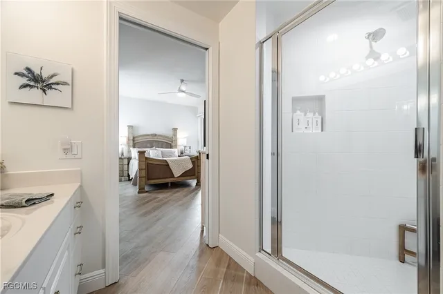 a en suite bathroom with a double vanity sink and a mirror