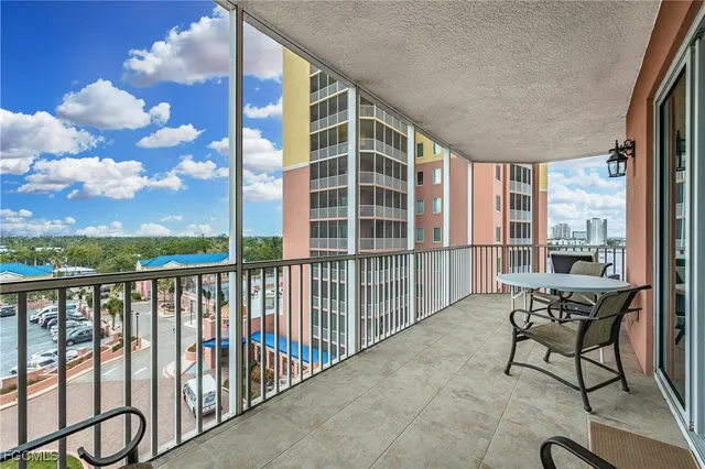 a balcony with furniture and city view
