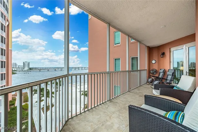 a balcony with furniture and a window