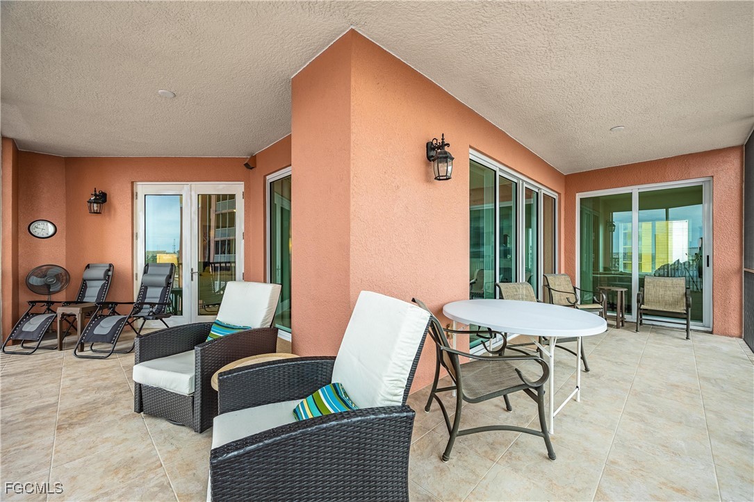 2745 First Street, Unit 705 Fort Myers, FL 33916 - Photo 28 of 49 a balcony with furniture and a window