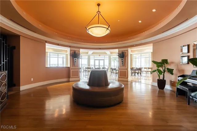a view of a dining room with furniture and a potted plant