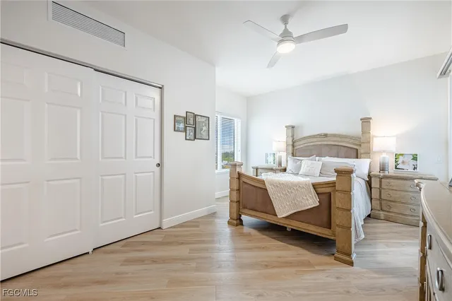 a bedroom with a bed and closet