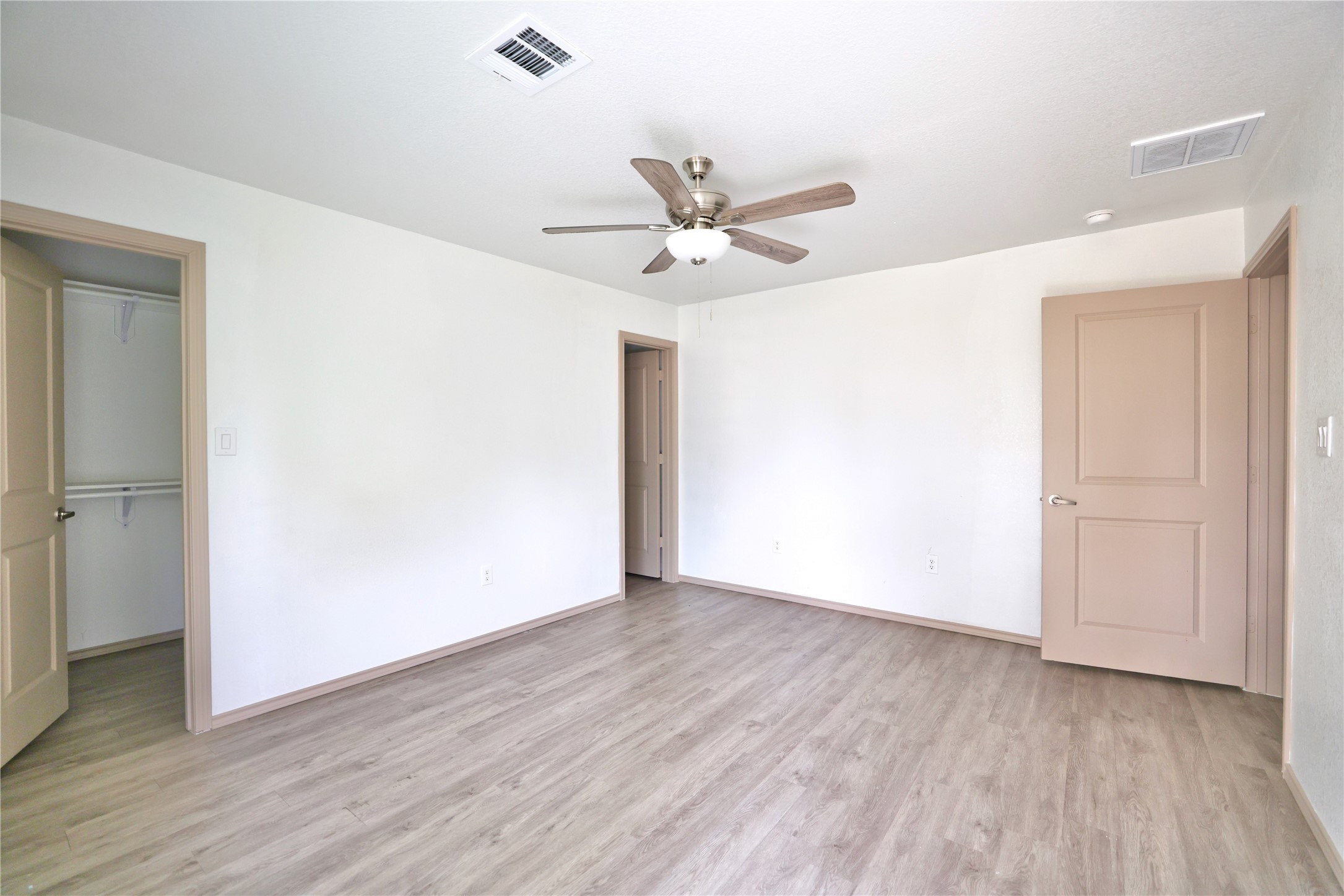 113 Bolden Street, Unit A Houston, TX 77029 - Photo 11 of 14 a view of an empty room with wooden floor