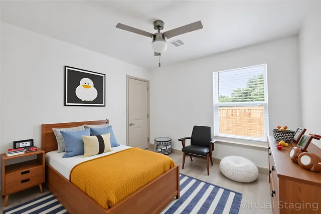 a bedroom with bed and a window