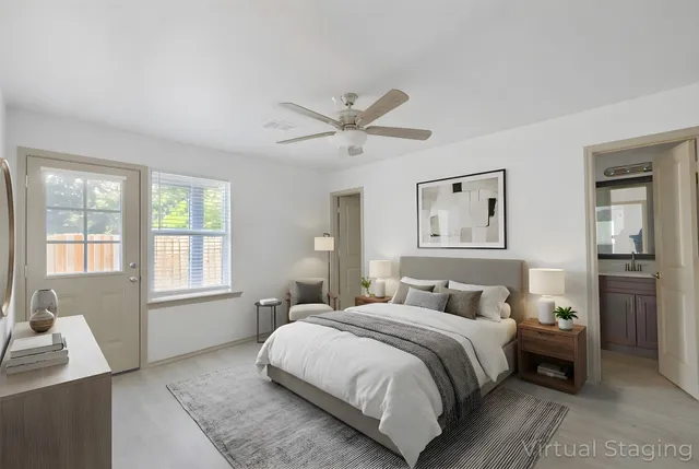 a bedroom with a large bed and a window