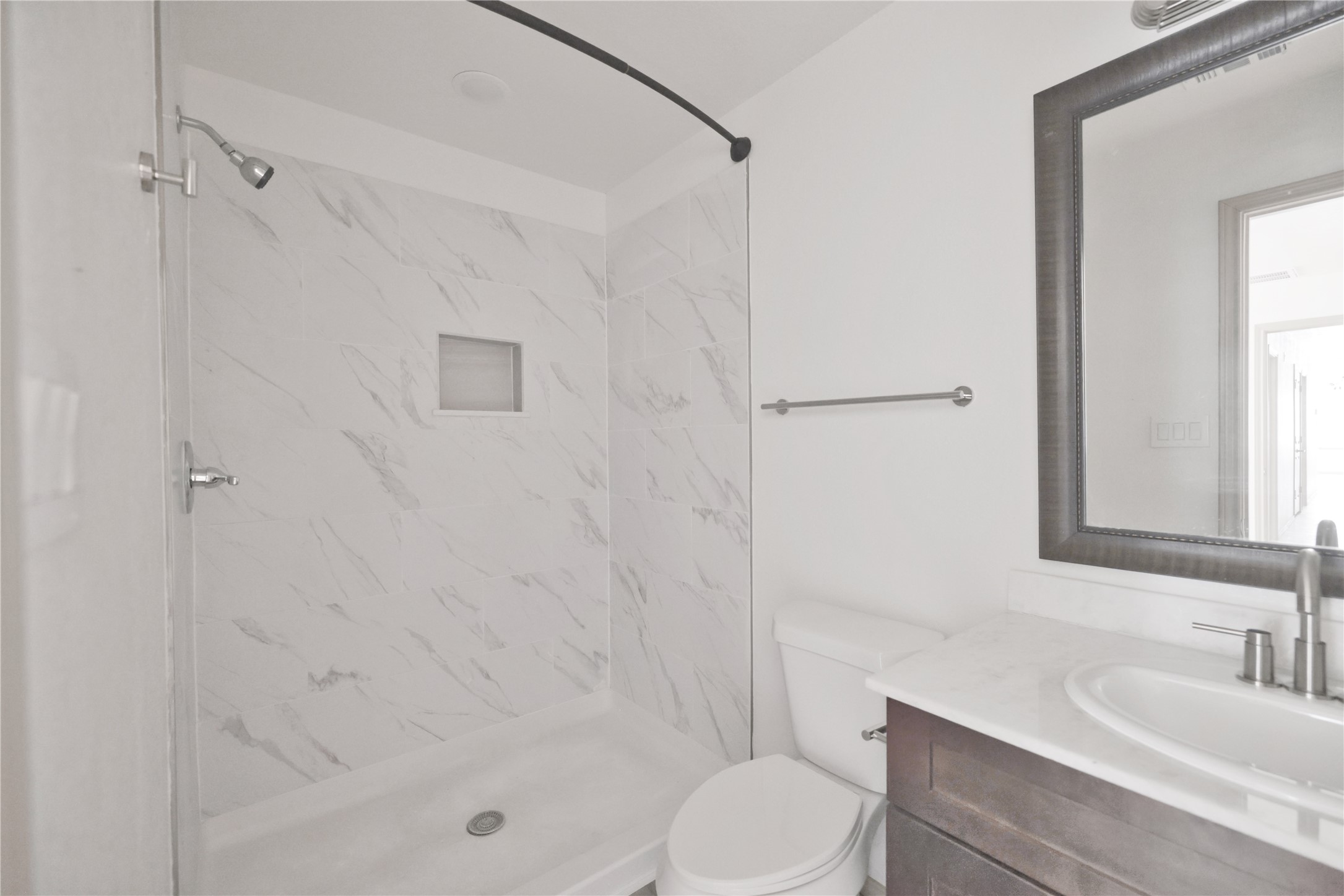 113 Bolden Street, Unit A Houston, TX 77029 - Photo 10 of 14 a bathroom with a bathtub shower sink vanity and toilet