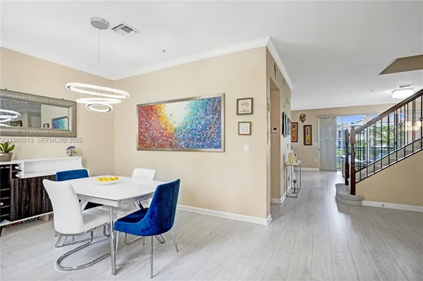 a view of a dining room with furniture window and wooden floor