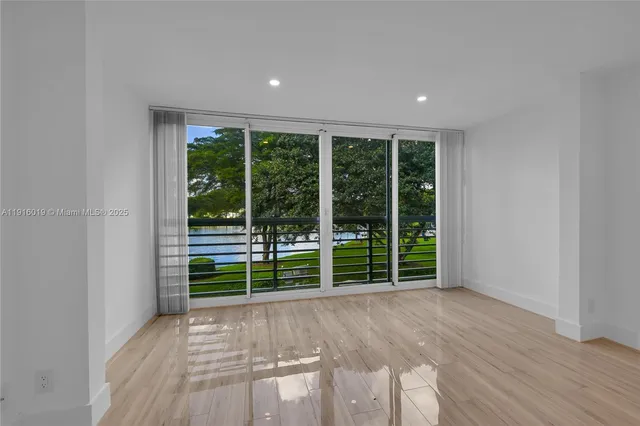 a view of outdoor space with wooden floor and windows