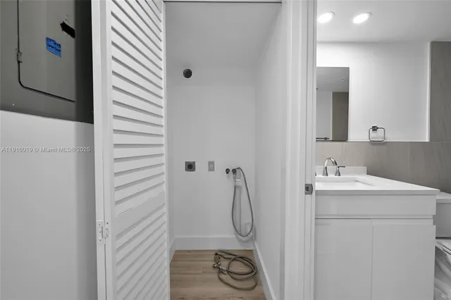 a bathroom with a granite countertop shower a sink and a stove