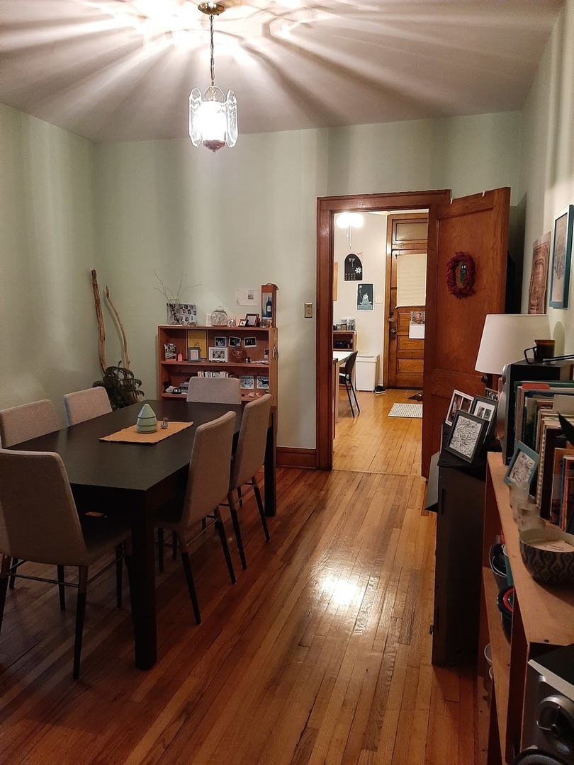 3142 South Morgan Street Chicago, IL 60608 - Photo 11 of 22 a view of a dining room with furniture and wooden floor
