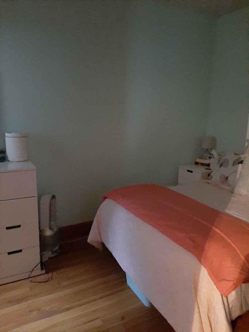 3142 South Morgan Street Chicago, IL 60608 - Photo 13 of 22 a bedroom with a bed and a dresser