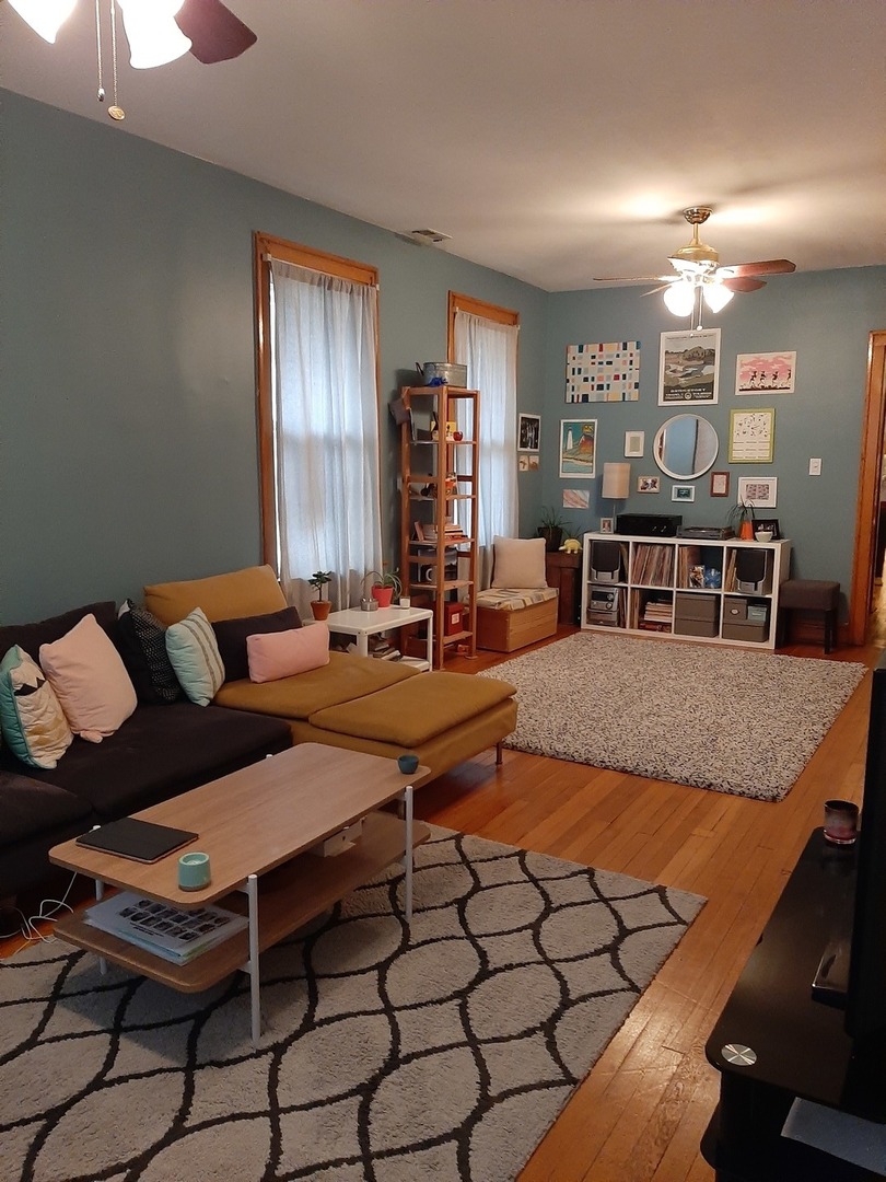 3142 South Morgan Street Chicago, IL 60608 - Photo 15 of 22 a living room with furniture a dining table and chairs