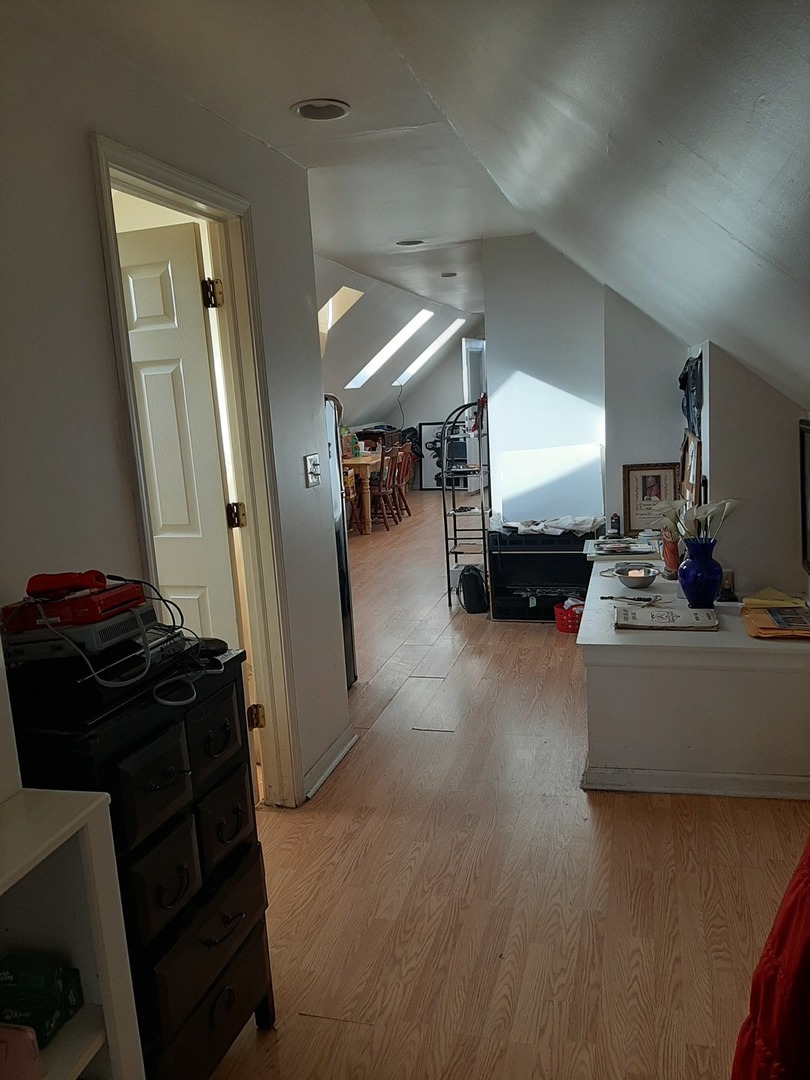 3142 South Morgan Street Chicago, IL 60608 - Photo 18 of 22 a living room with furniture and a mirror