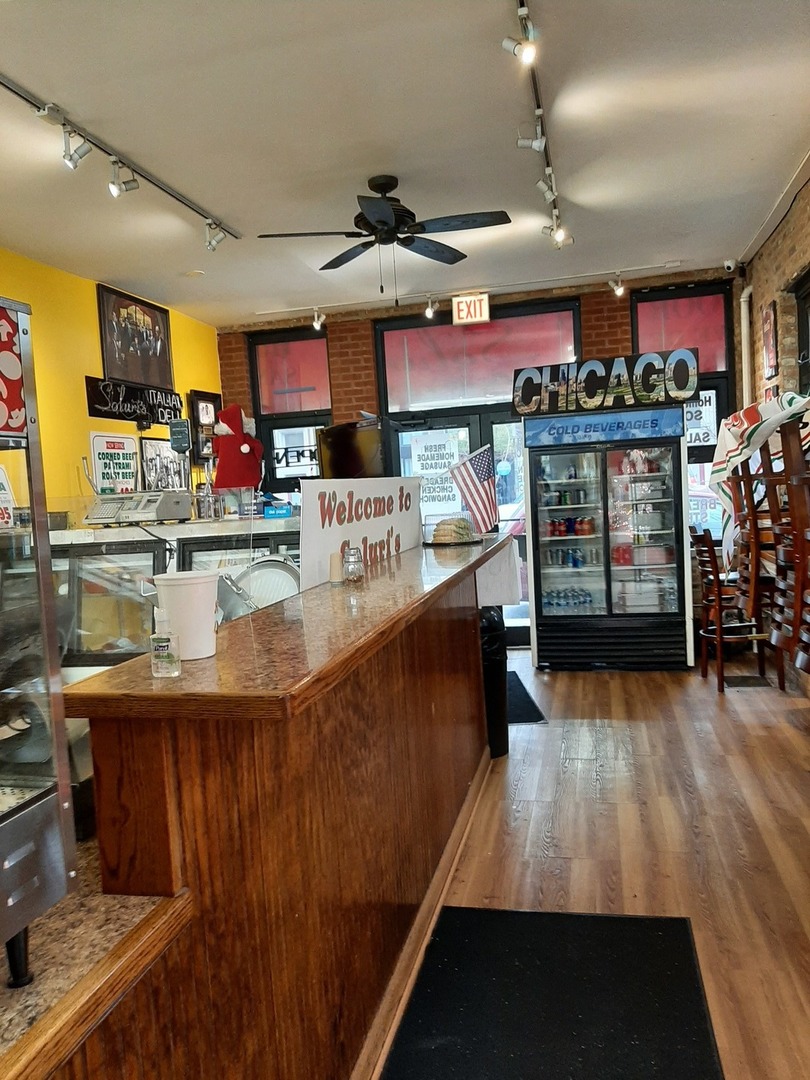 3142 South Morgan Street Chicago, IL 60608 - Photo 3 of 22 a kitchen with stainless steel appliances granite countertop a stove and cabinets