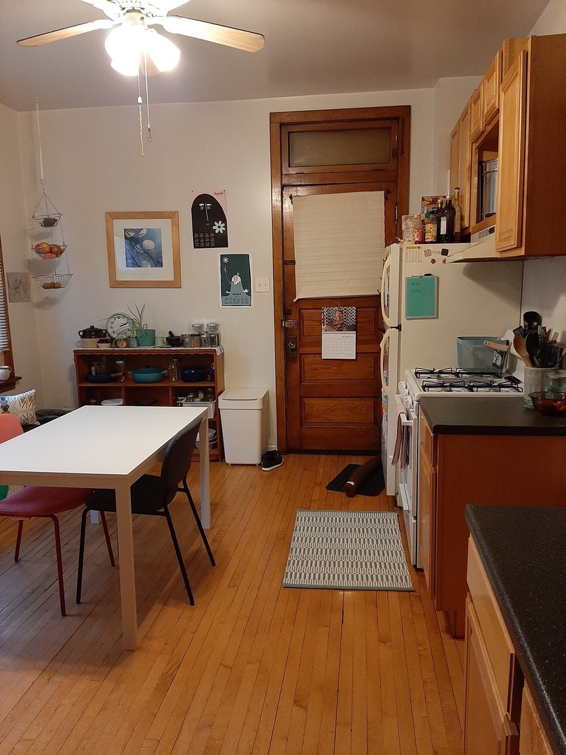 3142 South Morgan Street Chicago, IL 60608 - Photo 8 of 22 a kitchen with a table and chairs