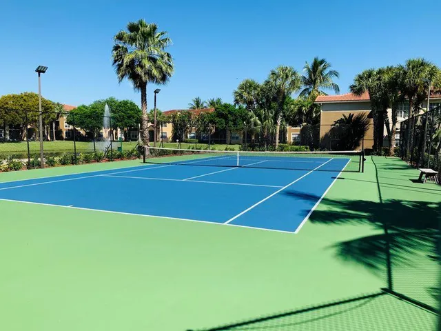 a view of an outdoor space and tennis court