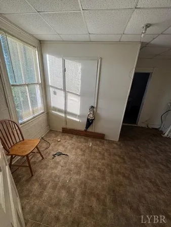 a view of a livingroom with furniture and staircase