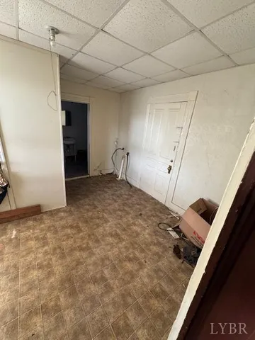 a view of an empty room with a fireplace