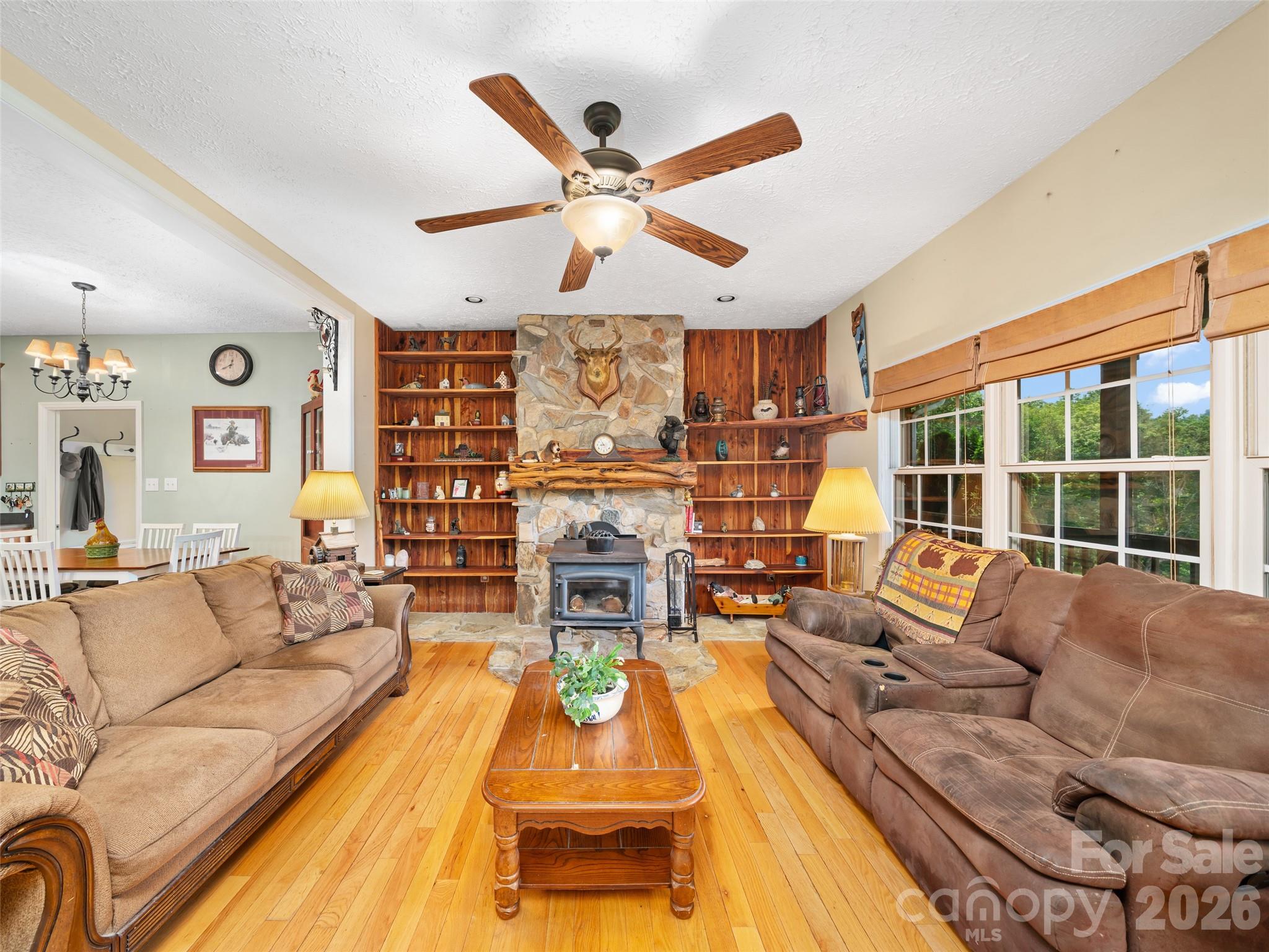 2216 Beans Creek Road Bakersville, NC 28705 - Photo 3 of 39 a living room with furniture and a large window