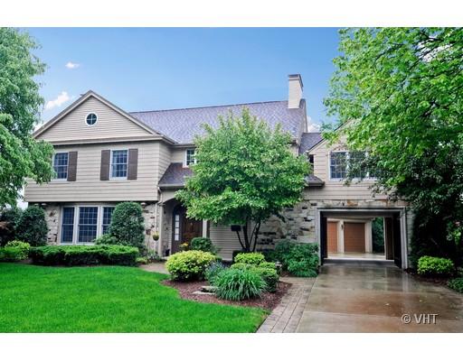 120 Fairbank Road Riverside, IL 60546 - Photo 1 of 16 a front view of a house with a yard and garage