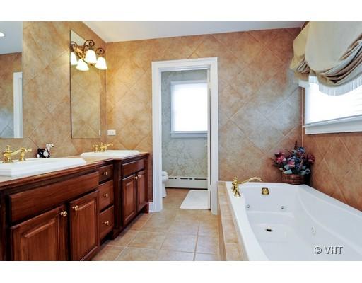 120 Fairbank Road Riverside, IL 60546 - Photo 11 of 16 a bathroom with a sink a mirror and a bathtub