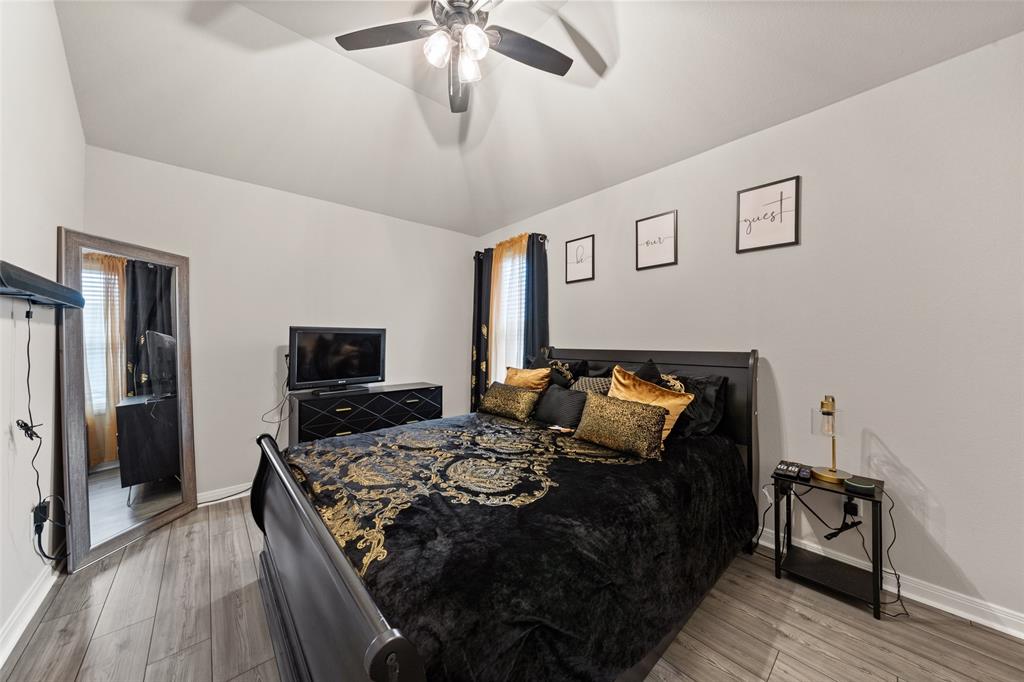 3525 Beutel Road Lorena, TX 76655 - Photo 26 of 34 a bed room with a bed and a television