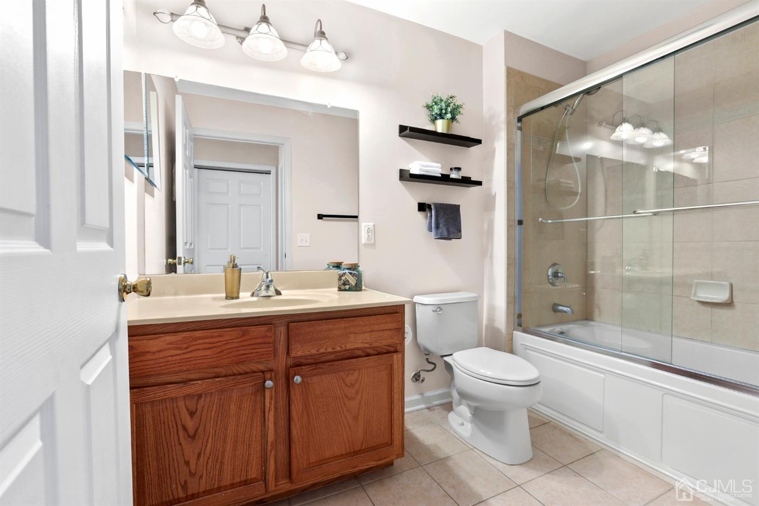 358 Rector Street, Unit 706 Perth Amboy, NJ 08861 - Photo 19 of 20 a bathroom with a sink a toilet and shower