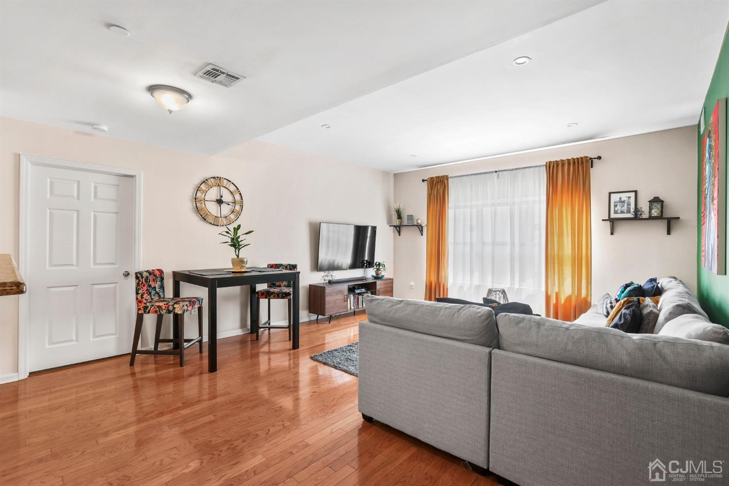 358 Rector Street, Unit 706 Perth Amboy, NJ 08861 - Photo 7 of 20 a living room with furniture and a wooden floor