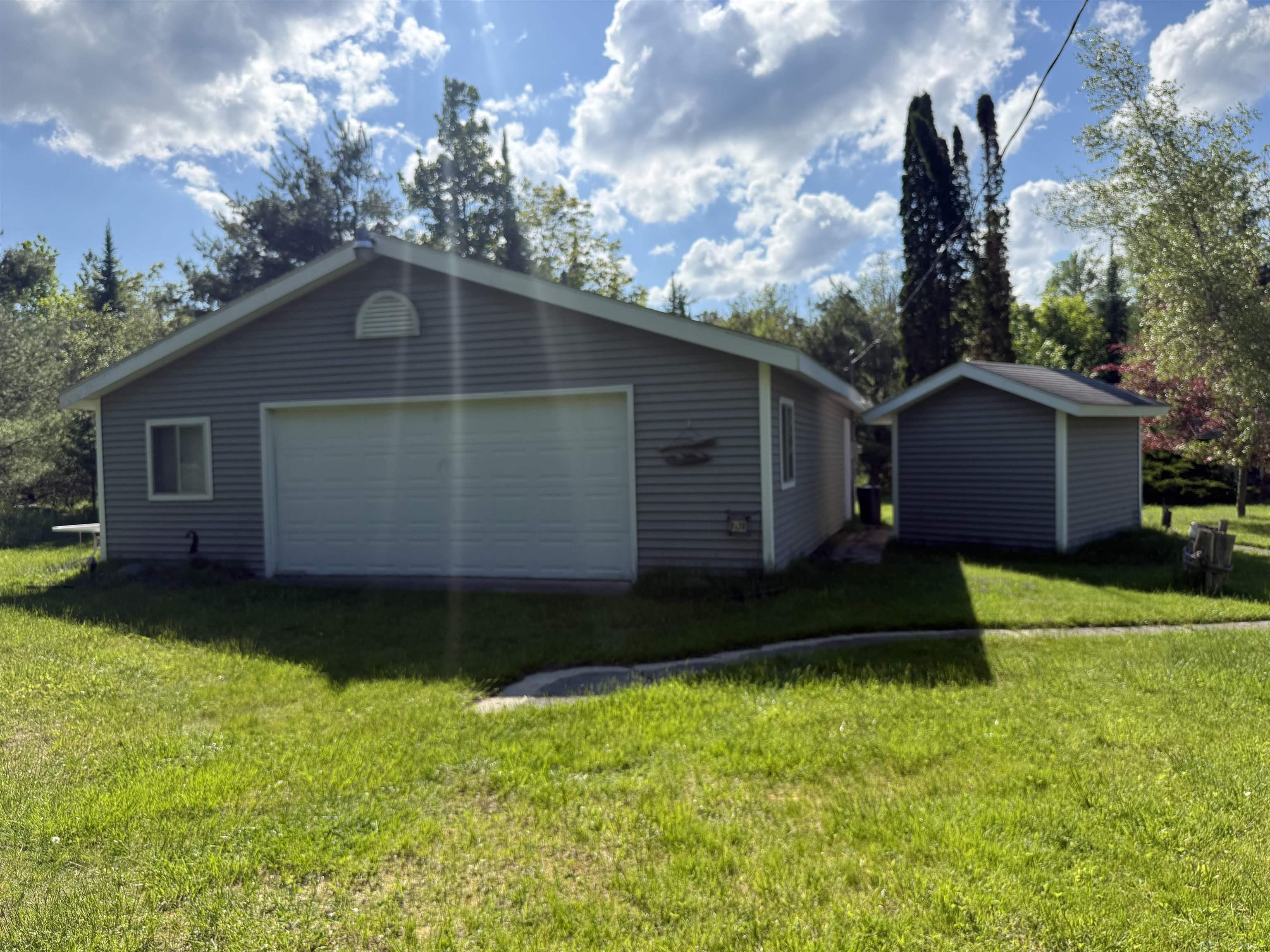 2125 Mckechnie Road Harrisville, MI 48740 - Photo 11 of 61 Maintenance free, vinyl sided and aluminum trim. Electricity, power garage door opener, Back 1/3 is covered into a 2 room guest house