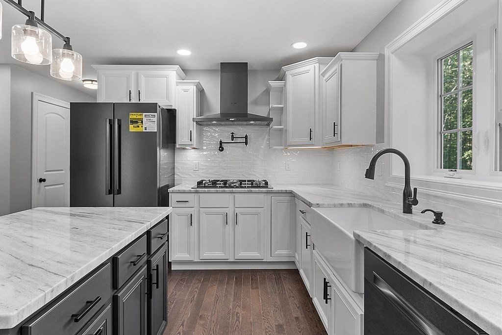 131 French Road, Unit LOT 10 Templeton, MA 01468 - Photo 15 of 35 a kitchen with granite countertop white cabinets and stainless steel appliances