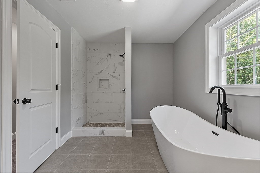 131 French Road, Unit LOT 10 Templeton, MA 01468 - Photo 33 of 35 a bathroom with a tub shower and window