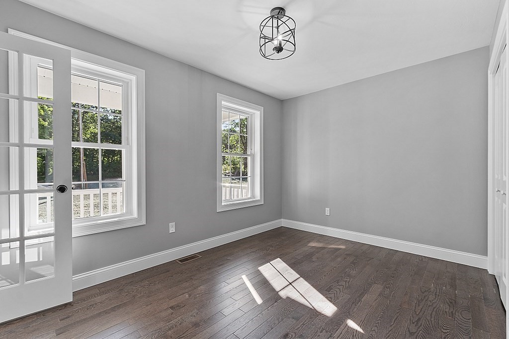 131 French Road, Unit LOT 10 Templeton, MA 01468 - Photo 7 of 35 an empty room with wooden floor and windows