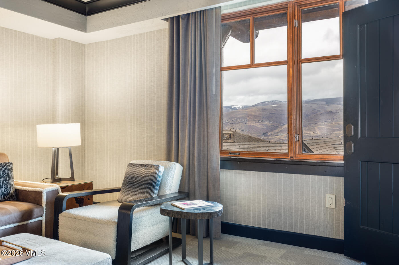 130 Daybreak Ridge Road, Unit HS725 Avon, CO 81620 - Photo 11 of 38 a view of a room with chairs and a window